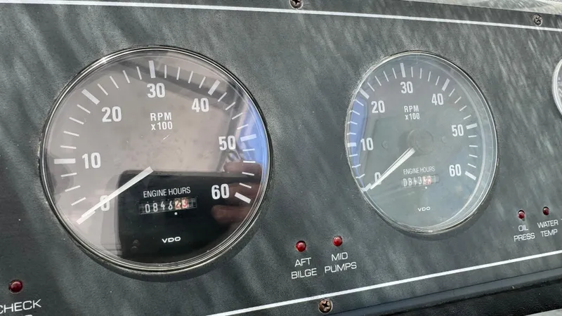 Slide: The Image of Dashboard of a 2003 Tiara Yachts 2900 Coronet showing RPM gauges and engine hours. - 15
