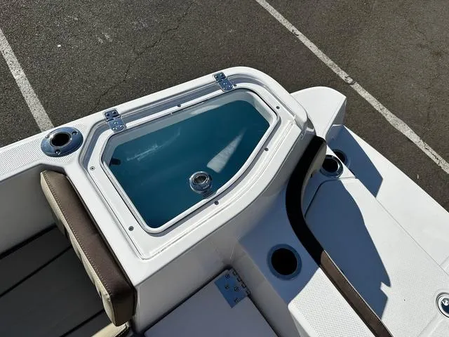 Slide: The Image of 2025 Yamaha Boats 255 FSH Sport H, featuring a sleek deck design and seating area. - 11
