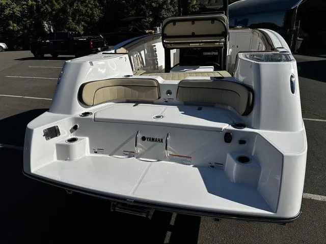 Slide: The Image of 2025 Yamaha Boats 255 FSH Sport H, rear view, showcasing seating and deck features. - 13
