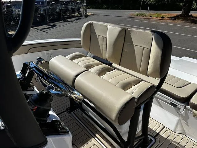 Slide: The Image of 2025 Yamaha Boats 255 FSH Sport H interior seating and steering wheel. - 4