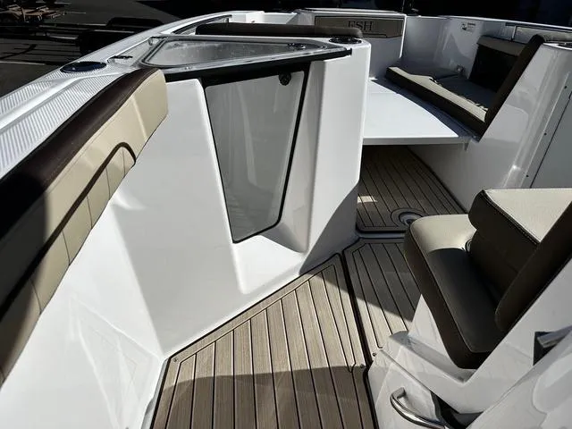 Slide: The Image of 2025 Yamaha Boats 255 FSH Sport H interior with sleek seating and modern design. - 7