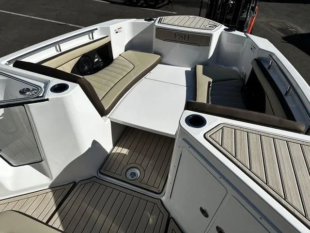 Slide: The Image of 2025 Yamaha Boats 255 FSH Sport H interior with seating and deck details. - 8