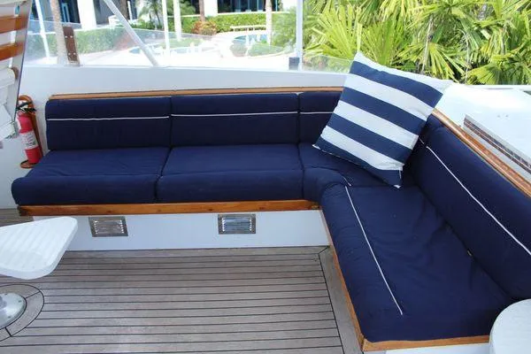 Slide: The Image of Luxurious seating area on 1983 Cheoy Lee 90 cockpit motor yacht with blue cushions. - 17