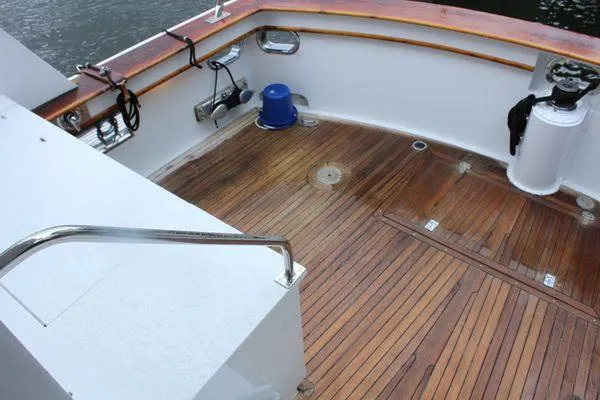 Slide: The Image of 1983 Cheoy Lee 90 cockpit motor yacht with teak deck and railing. - 37