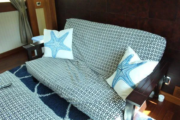 Slide: The Image of Cozy yacht interior with patterned sofa and starfish-themed pillows, Cheoy Lee 90 cockpit motor yacht. - 47