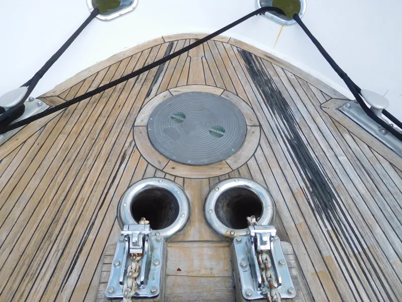 Slide: The Image of 1983 Cheoy Lee 90 cockpit motor yacht deck with anchor chain ports. - 7