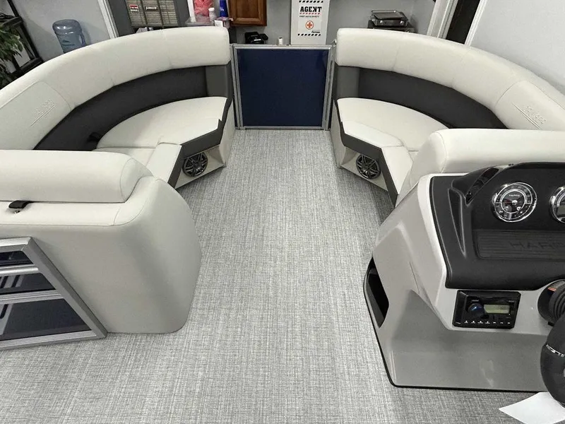 Slide: The Image of 2024 Harris Cruiser 190 interior with plush seating and modern dashboard. - 8