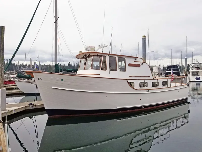 The Image of Vintage 1963 Grand Banks 35 Chantyman boat docked in a marina. - 0