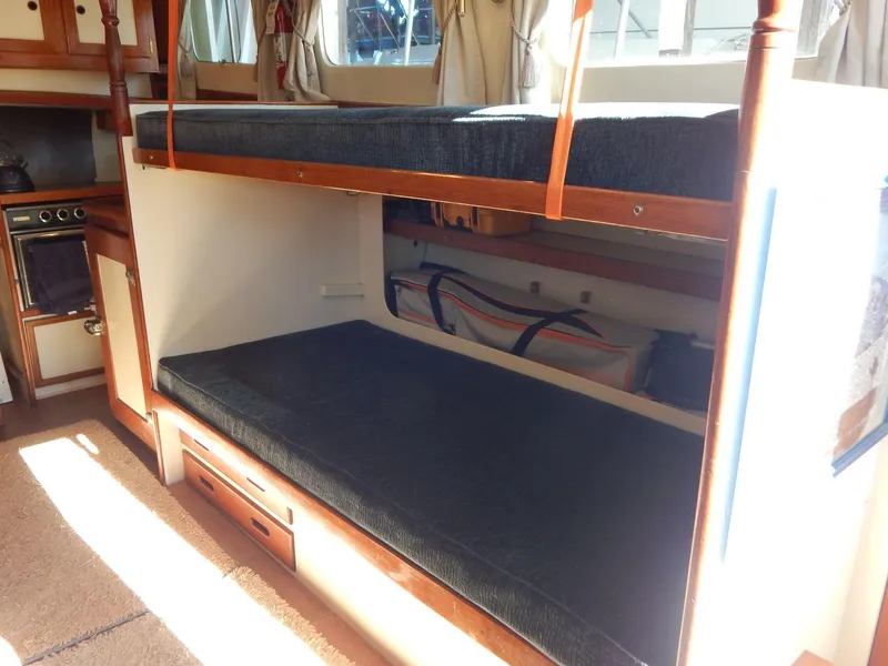 Slide: The Image of Interior of 1963 Grand Banks 35 Chantyman with bunk beds and wooden cabinetry. - 6
