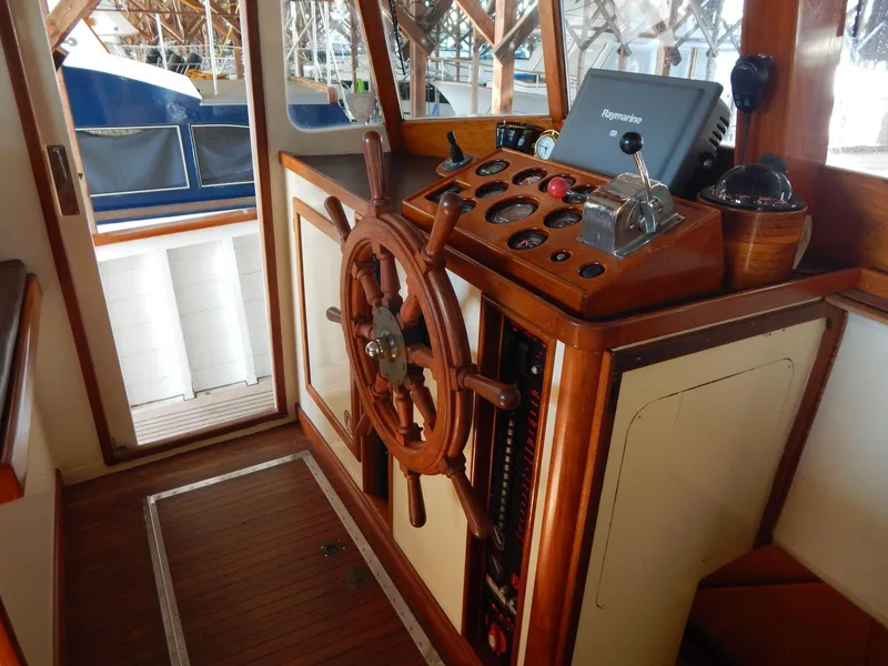 Slide: The Image of Interior helm of 1963 Grand Banks 35 Chantyman with wooden wheel and navigation equipment. - 10