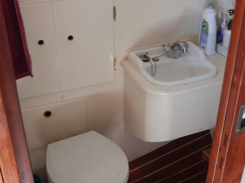 Slide: The Image of Bathroom interior of 1963 Grand Banks 35 Chantyman boat with sink and toilet. - 9