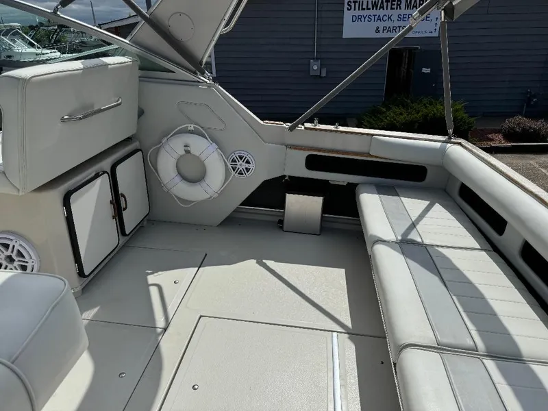 Slide: The Image of 1987 Sea Ray 340 Express Cruiser interior with seating and storage compartments. - 17