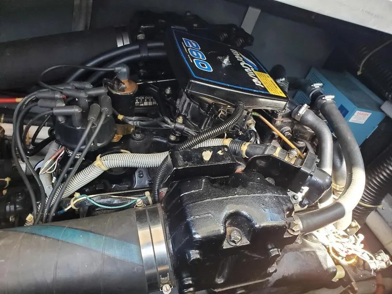 Slide: The Image of Engine of 1987 Sea Ray 340 Express Cruiser, showcasing detailed components and wiring. - 23