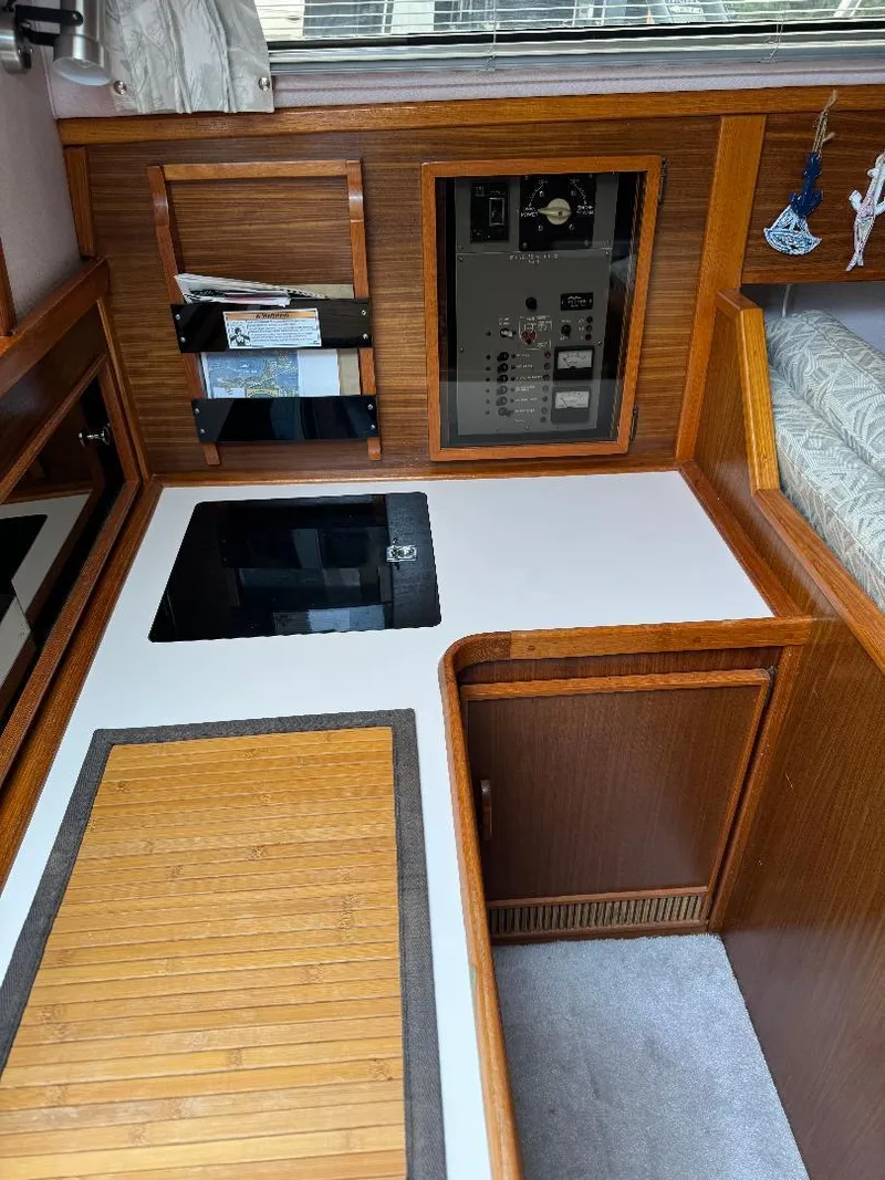 Slide: The Image of 1987 Sea Ray 340 Express Cruiser interior with wood paneling and control panel. - 6