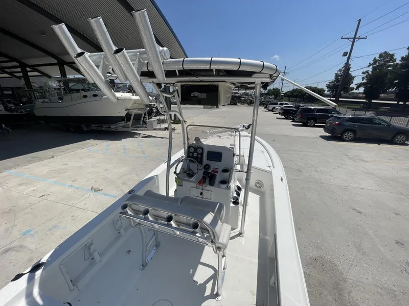 Slide: The Image of 2014 Sea Hunt Bay Boat BX 22 Pro in a parking lot, showcasing console and seating. - 10