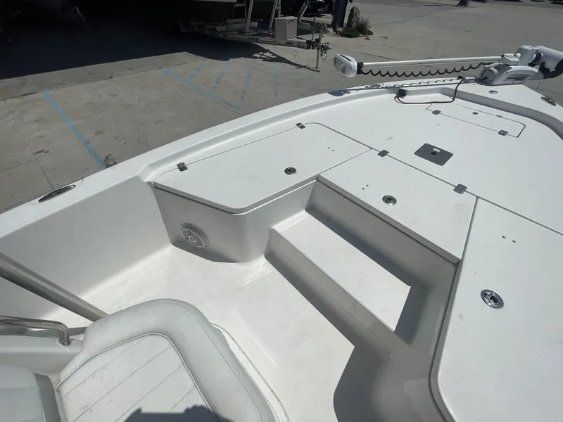 Slide: The Image of 2014 Sea Hunt Bay Boat BX 22 Pro deck with seating and storage compartments. - 13