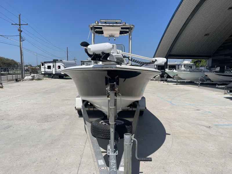 Slide: The Image of 2014 Sea Hunt Bay Boat BX 22 Pro on trailer in marina. - 15