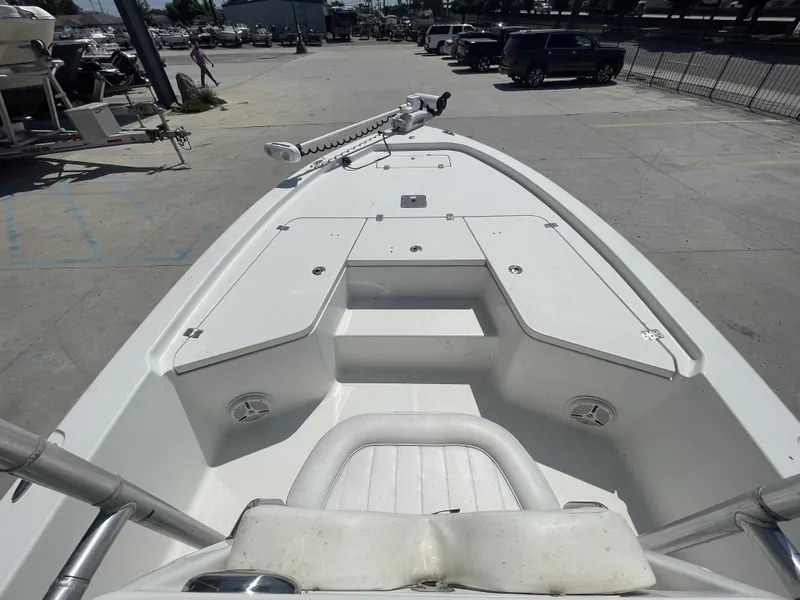 Slide: The Image of 2014 Sea Hunt Bay Boat BX 22 Pro, white deck, parked in a marina. - 16