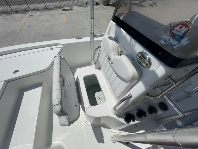 Slide: The Image of 2014 Sea Hunt Bay Boat BX 22 Pro interior with seating and storage compartments. - 19