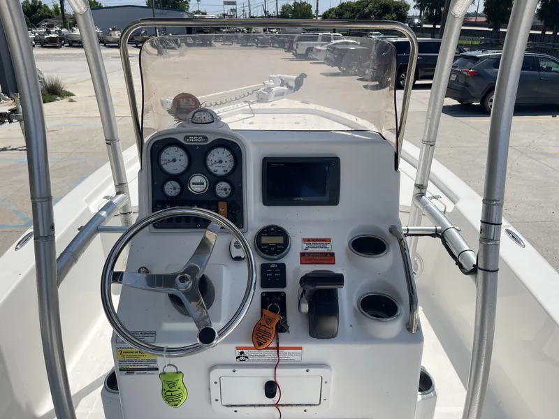 Slide: The Image of 2014 Sea Hunt Bay Boat BX 22 Pro dashboard with steering wheel and gauges. - 20