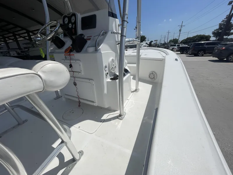 Slide: The Image of 2014 Sea Hunt Bay Boat BX 22 Pro interior with steering console and seating. - 21
