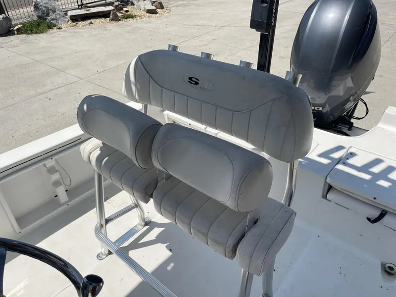 Slide: The Image of 2014 Sea Hunt Bay Boat BX 22 Pro with cushioned seating and motor. - 23