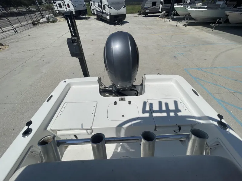 Slide: The Image of 2014 Sea Hunt Bay Boat BX 22 Pro with outboard motor in a storage lot. - 25