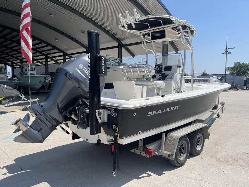 Slide: The Image of 2014 Sea Hunt Bay Boat BX 22 Pro on trailer, under covered area. - 3