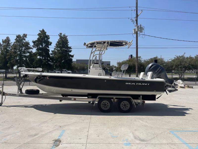 Slide: The Image of 2014 Sea Hunt Bay Boat BX 22 Pro on trailer in outdoor setting. - 4