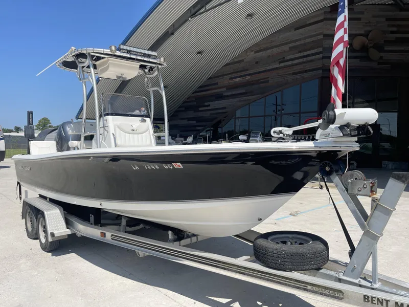 Slide: The Image of 2014 Sea Hunt Bay Boat BX 22 Pro on trailer, parked outdoors. - 6