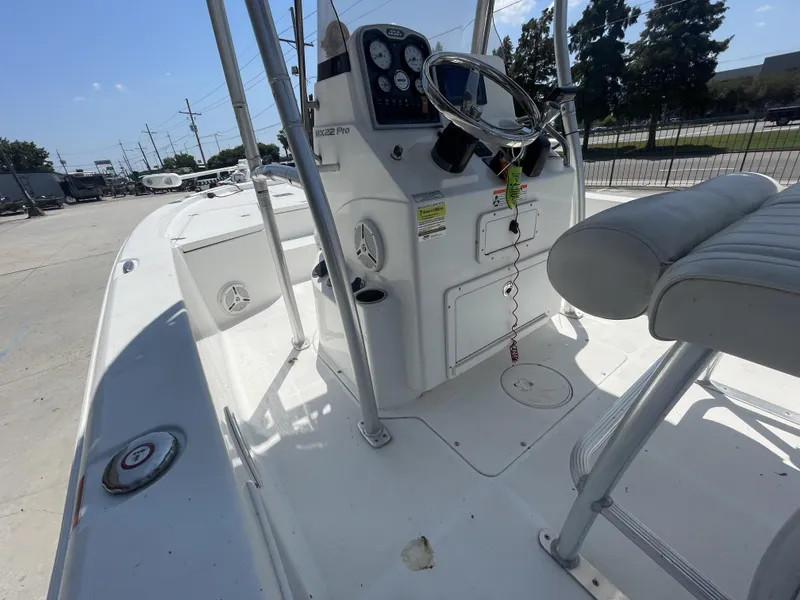 Slide: The Image of 2014 Sea Hunt Bay Boat BX 22 Pro interior with steering console and seating. - 7