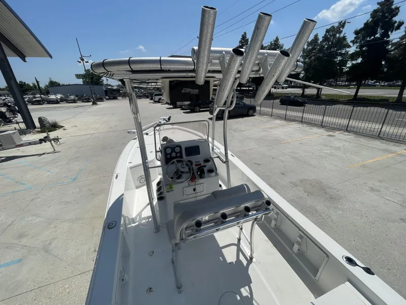 Slide: The Image of 2014 Sea Hunt Bay Boat BX 22 Pro with T-top and console, parked outdoors. - 9