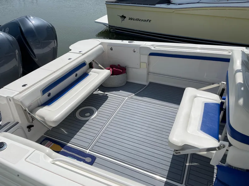 Slide: The Image of 2015 Wellcraft 35 Scarab boat interior with seating and twin engines. - 14
