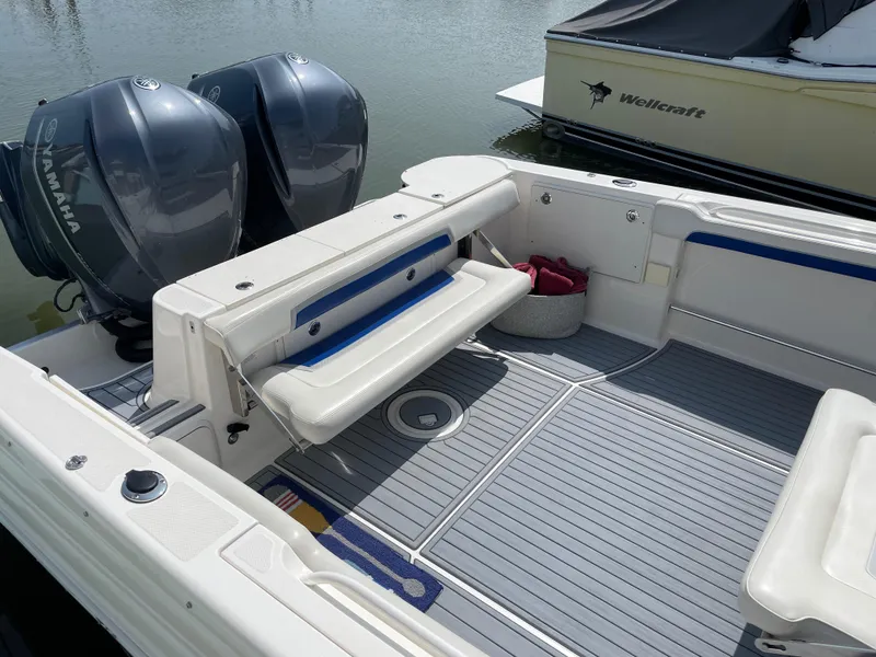 Slide: The Image of 2015 Wellcraft 35 Scarab boat interior with Yamaha engines, featuring seating and storage. - 15