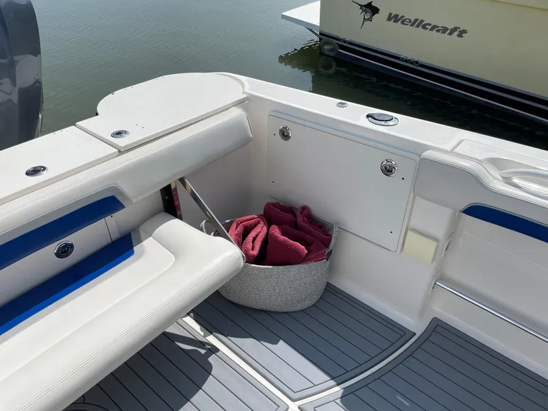 Slide: The Image of 2015 Wellcraft 35 Scarab boat interior with seating and storage basket. - 20