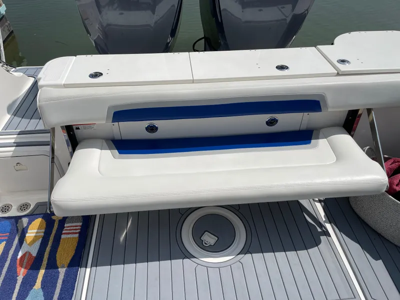 Slide: The Image of 2015 Wellcraft 35 Scarab boat with white seating and deck, featuring dual engines. - 21