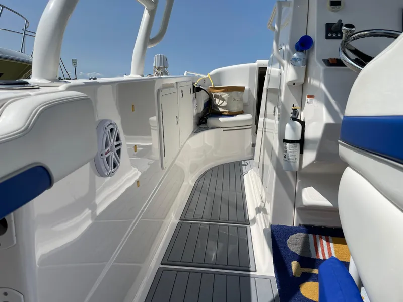 Slide: The Image of 2015 Wellcraft 35 Scarab interior with seating, storage, and marine equipment. - 26