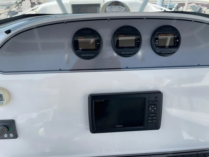 Slide: The Image of Dashboard of 2015 Wellcraft 35 Scarab with gauges and Garmin display. - 27