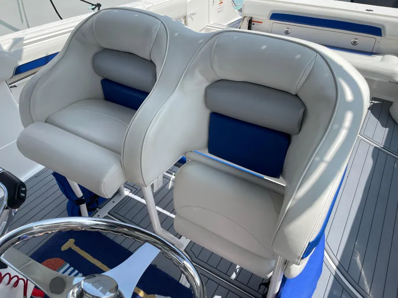 Slide: The Image of Luxury seating on 2015 Wellcraft 35 Scarab boat, featuring plush white and blue upholstery. - 29