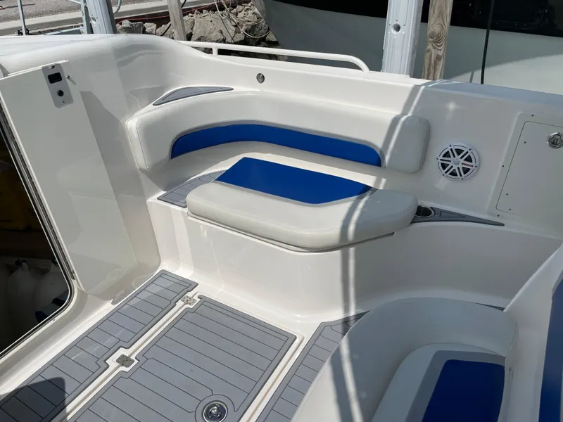 Slide: The Image of 2015 Wellcraft 35 Scarab boat interior with blue and white seating and speaker. - 32