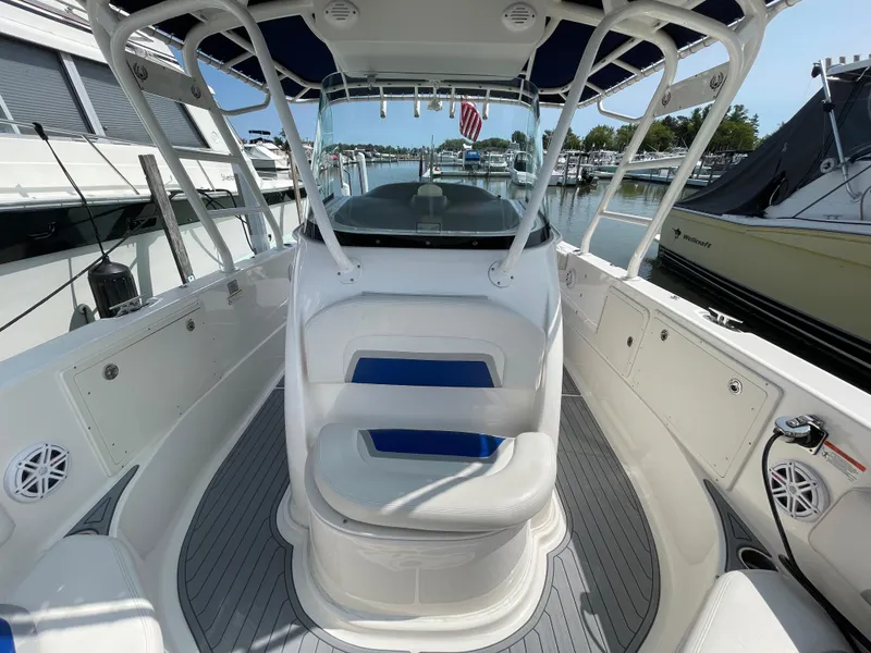 Slide: The Image of 2015 Wellcraft 35 Scarab boat interior with seating, docked at marina. - 33