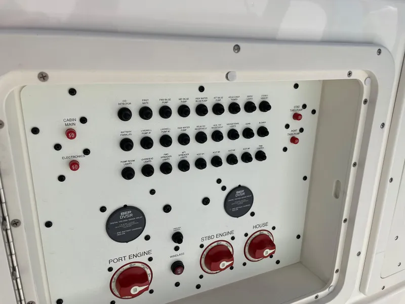 Slide: The Image of Control panel of a 2015 Wellcraft 35 Scarab boat, featuring switches and dials. - 40