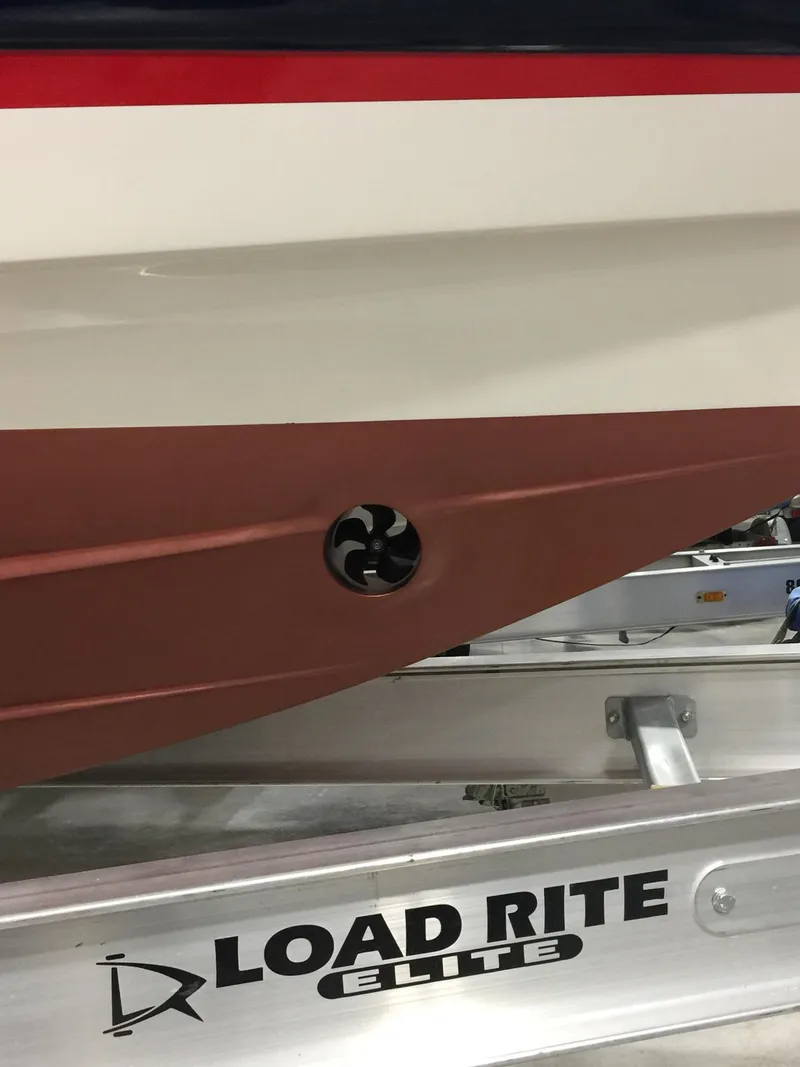 Slide: The Image of 2015 Wellcraft 35 Scarab boat on Load Rite Elite trailer, close-up of hull detail. - 49