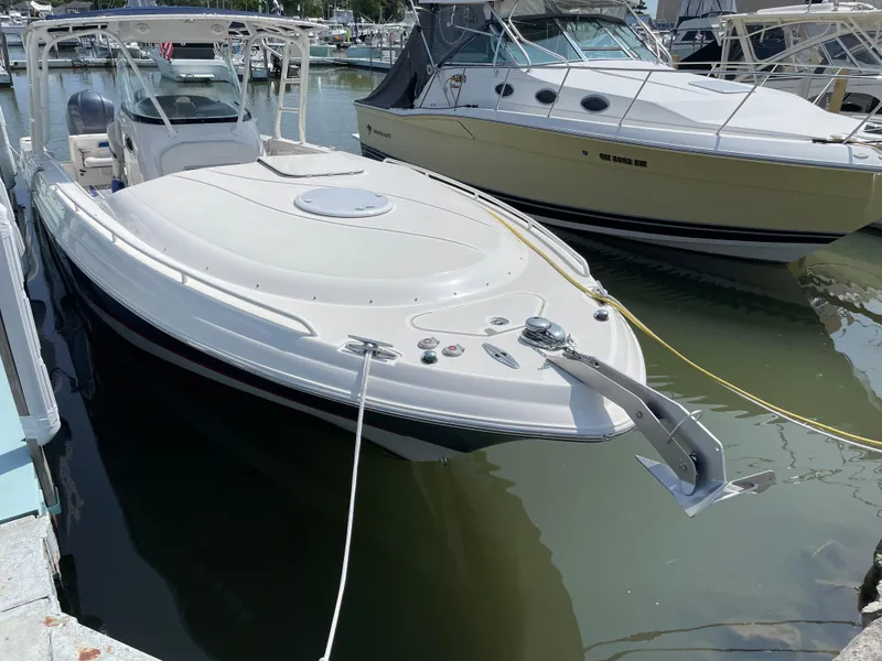 Slide: The Image of 2015 Wellcraft 35 Scarab boat docked in marina, featuring sleek design and modern amenities. - 5