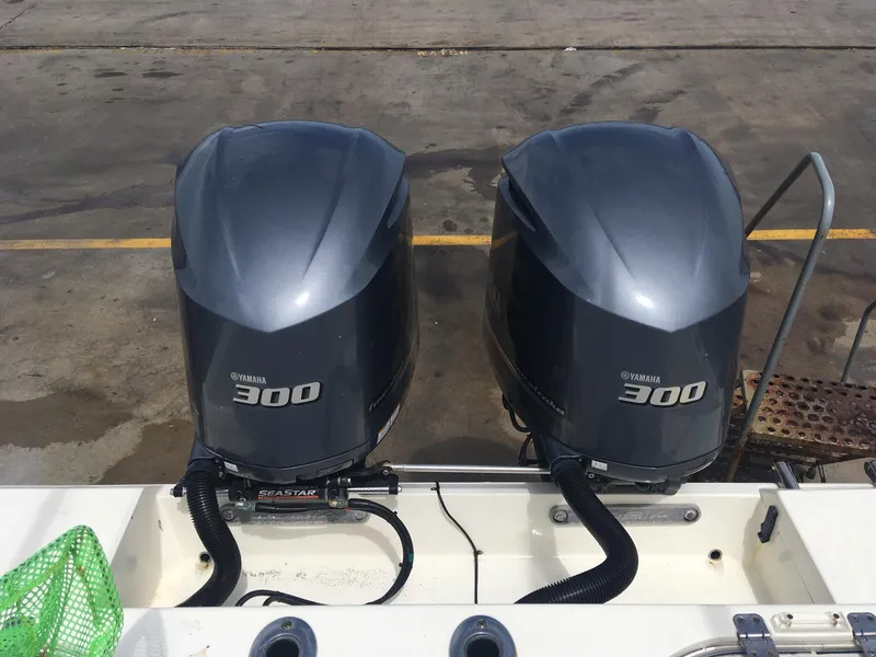 Slide: The Image of Twin Yamaha 300 engines on a 2017 Cobia 296 CC boat. - 17