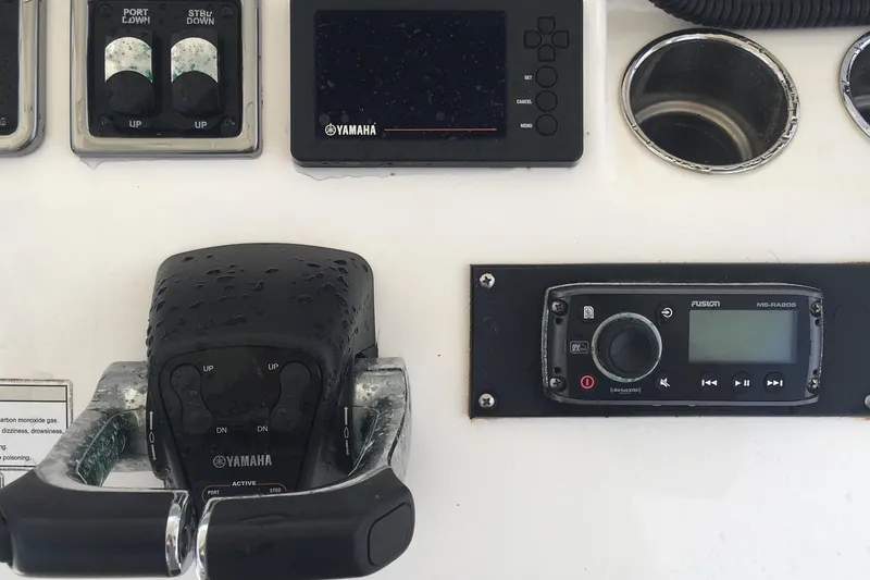 Slide: The Image of Close-up of 2017 Cobia 296 CC boat controls and Yamaha equipment. - 27
