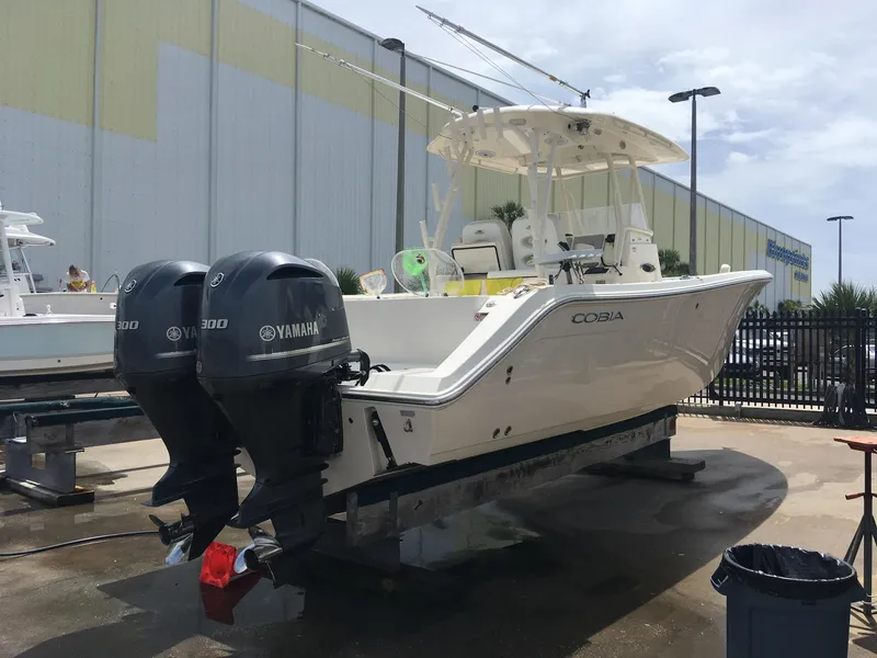 Slide: The Image of 2017 Cobia 296 CC boat with twin Yamaha engines on display. - 6