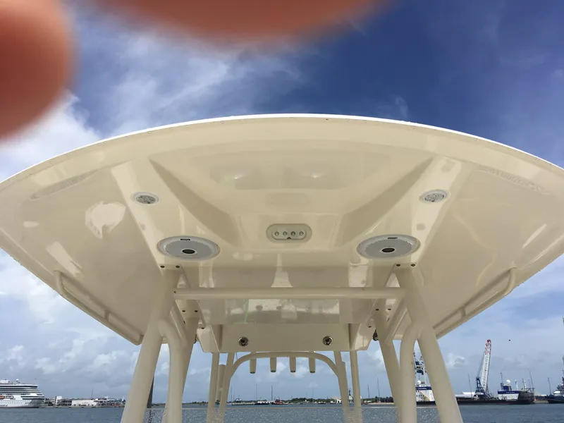 Slide: The Image of Cobia 296 CC 2017 boat canopy against a clear blue sky. - 7