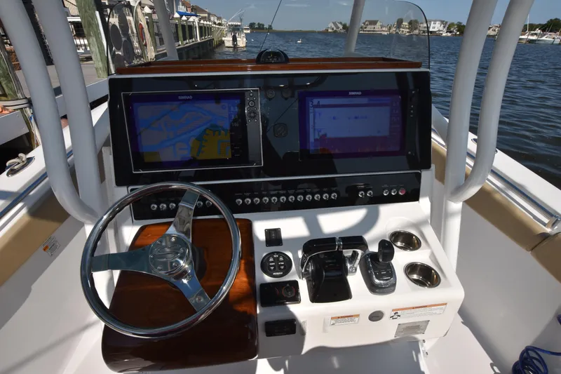 Slide: The Image of 2016 Sportsman Open 312 Center Console dashboard with navigation screens and steering wheel. - 20