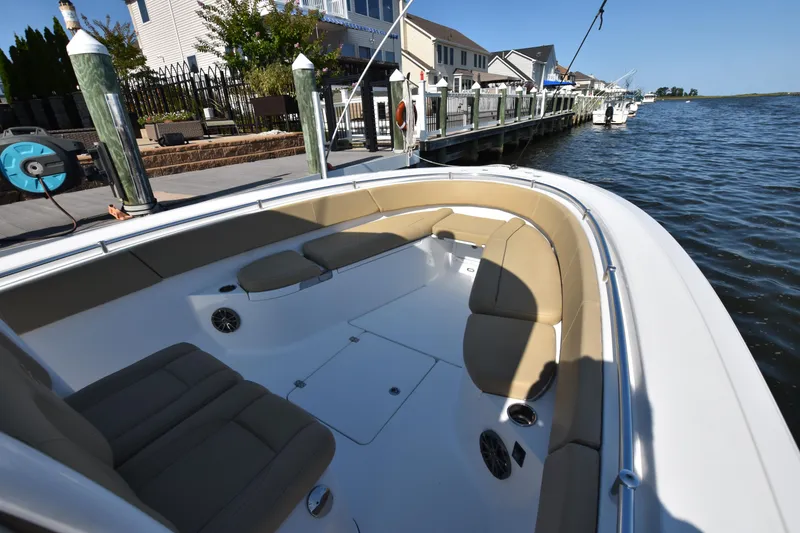Slide: The Image of 2016 Sportsman Open 312 Center Console boat docked by waterfront homes. - 23